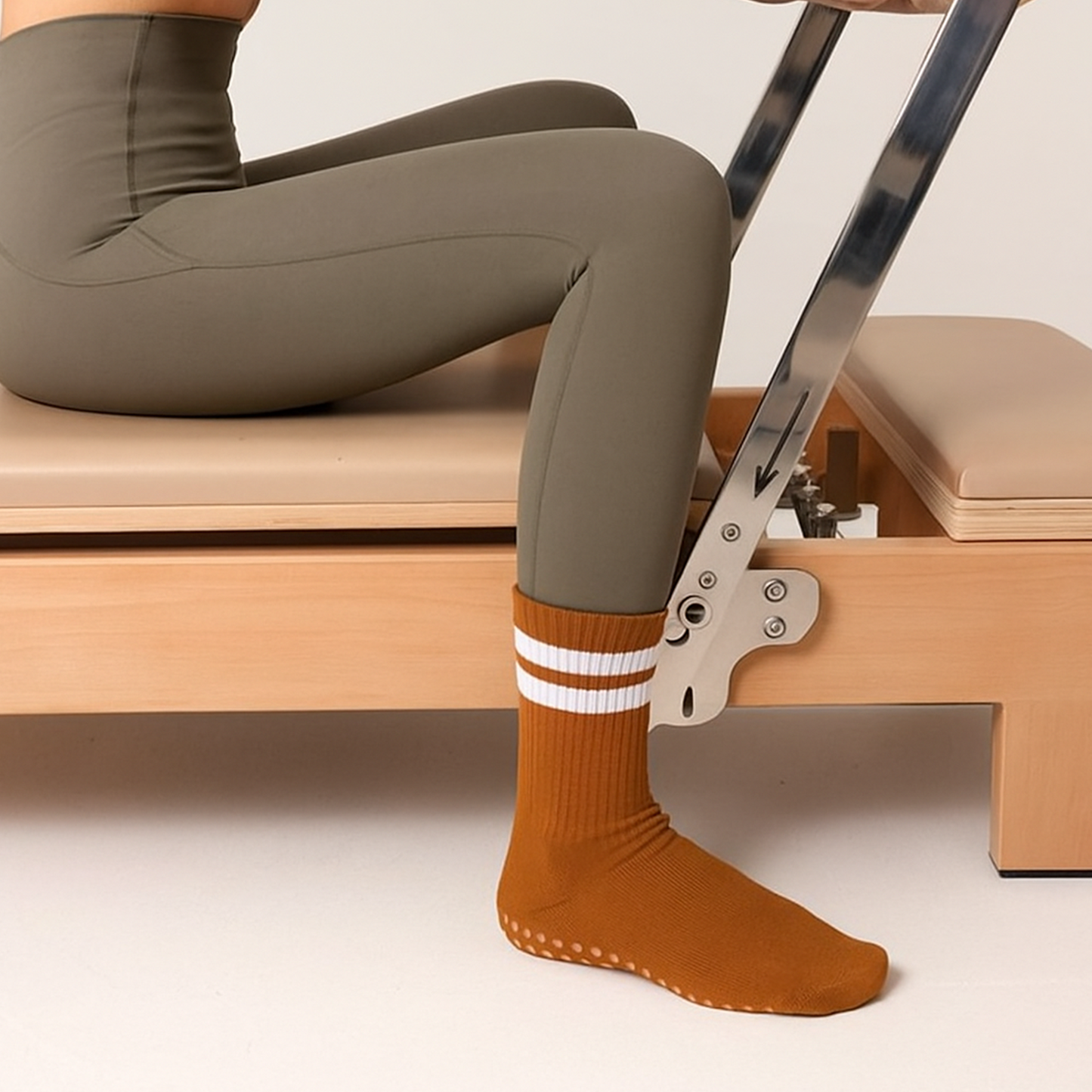 Rust-colored pilates socks with grip for reformer workouts – The Fit Fab Co