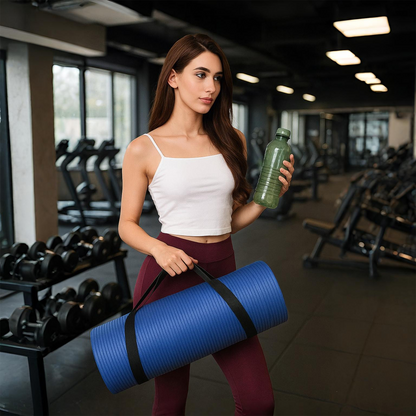 Blue yoga mat with carrying strap, held by woman in gym – The Fit Fab Co

