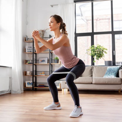 Indoor lower body exercise with gray resistance band – The Fit Fab Co

