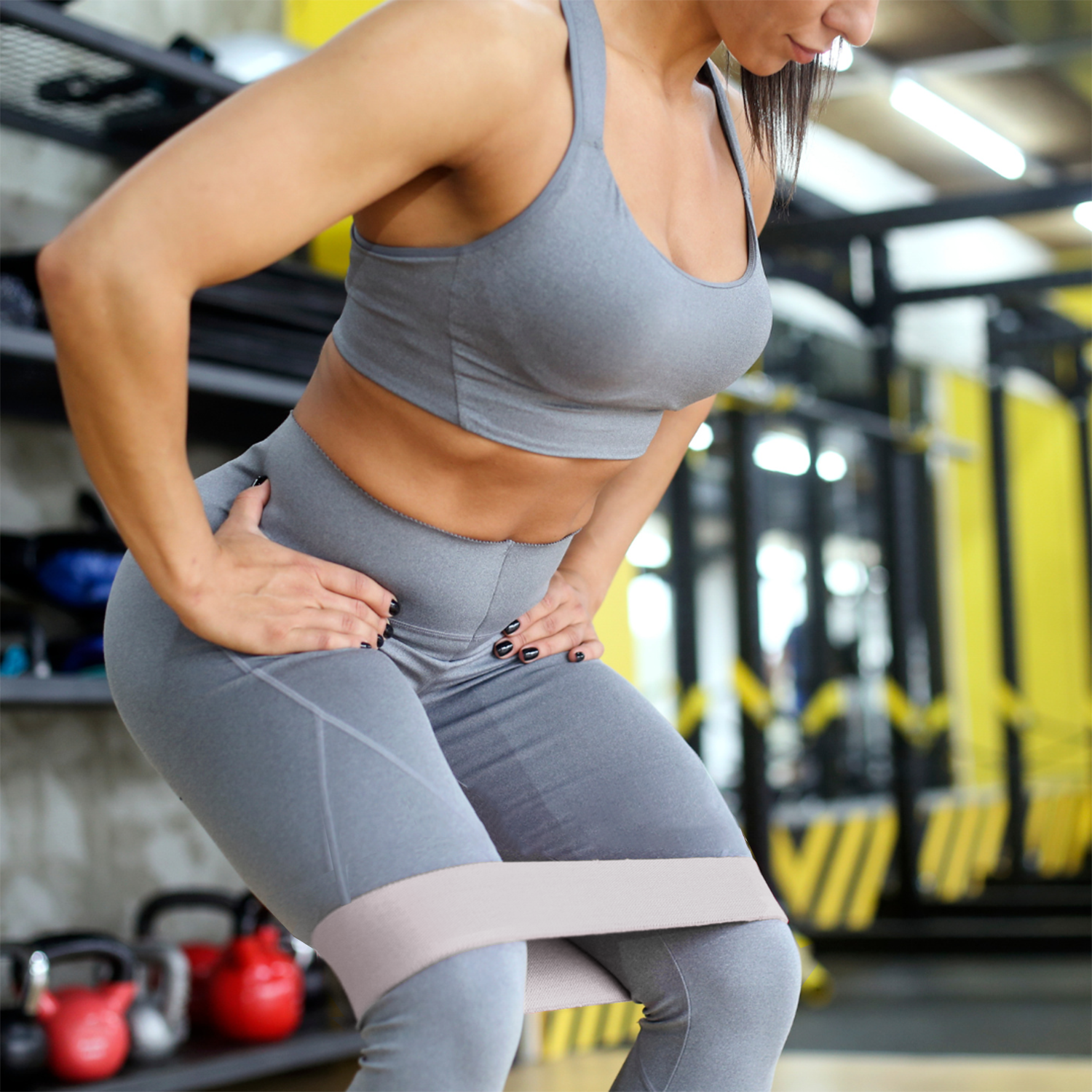 Resistance band glute activation during squat in gym – The Fit Fab Co

