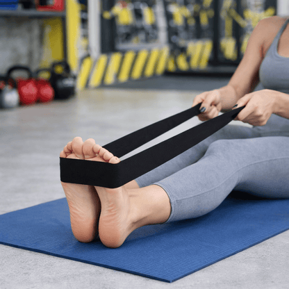 woman performing leg workout using resistance bands