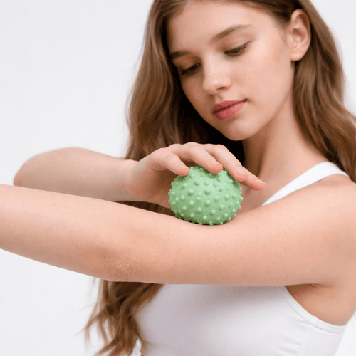 massage therapy ball for arm tension and circulation