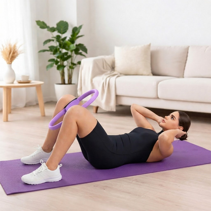 woman using pilates ring on yoga mat for home workout